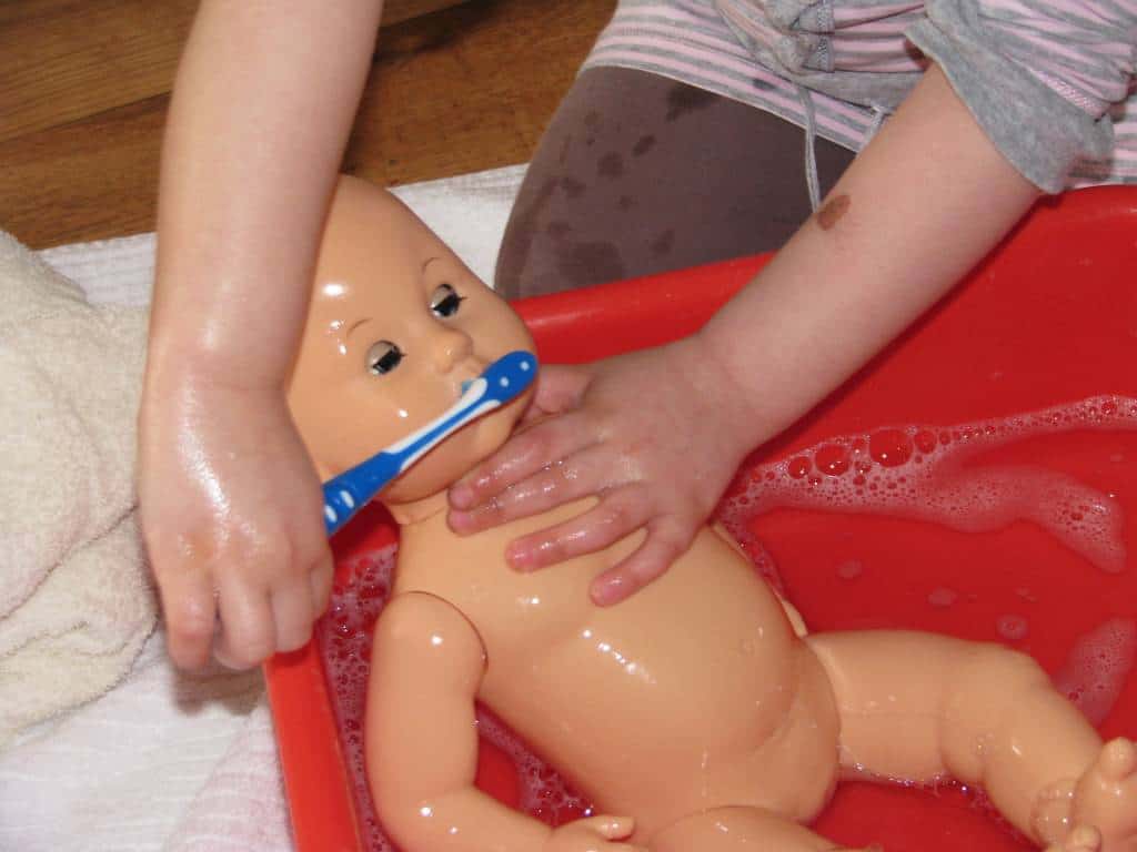 Washing a toy baby