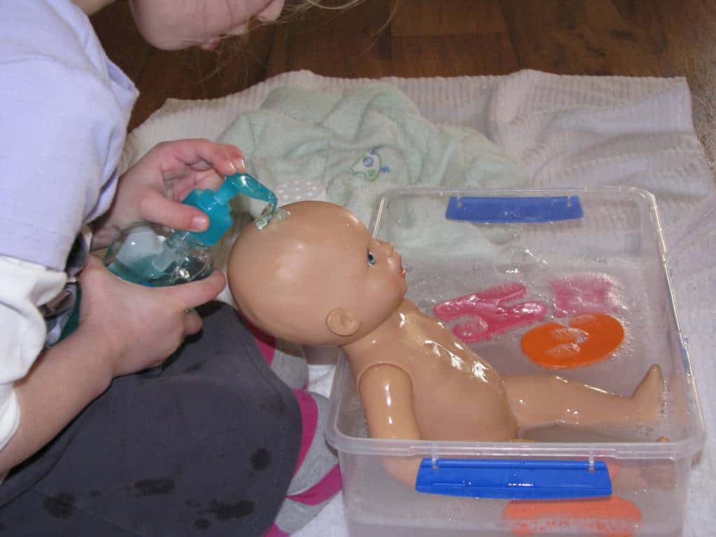 Washing a toy baby