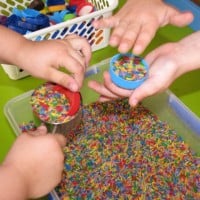 Rainbow rice and bottles tops