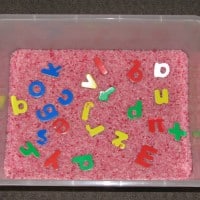 Alphabet hunt using rice for a sensory experience