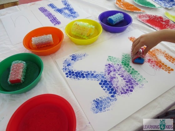 Name activity using paint and bubble wrap covered blocks by learning 4 kids