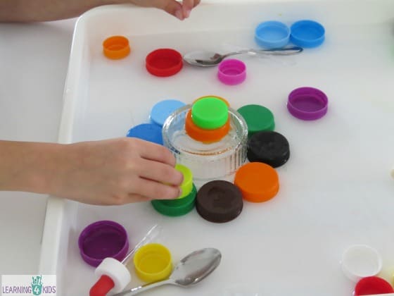 Creative Play with bottle tops, water and eye droppers