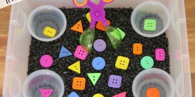 Learning about shapes in a sensory bin activity