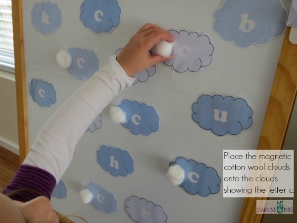 Place the magnetic cotton clouds onto the letter c