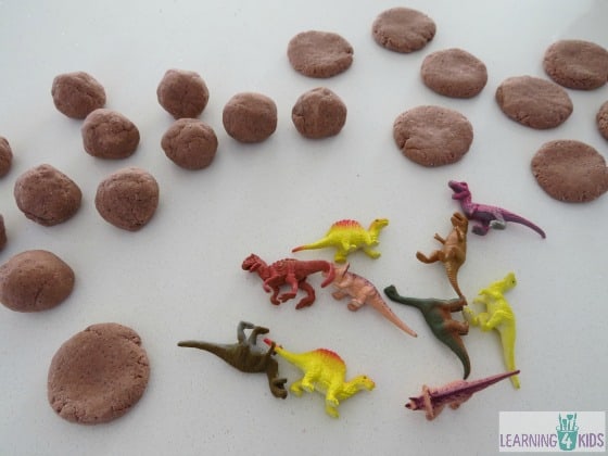 how to make dinosaur fossils - roll small salt dough balls and press gently with your palm