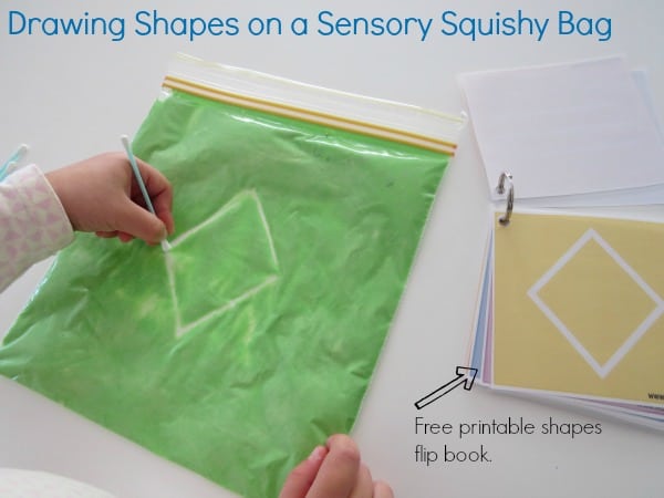 Drawing shapes on a sensory Squishy bag with free printable shapes flip book