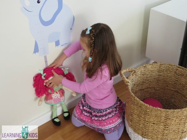 Measurement activity for kids using a height chart and stuffed toys