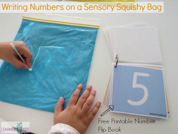 Writing Numbers on a Sensory Squishy Bag with free printable number flip book
