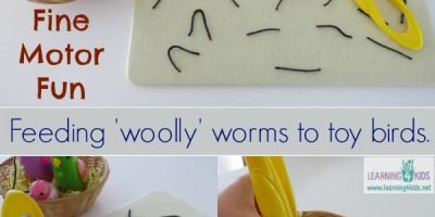Fine motor activity for kids - pretnd feeding 'woolly' (yarn) worms to toy birds.