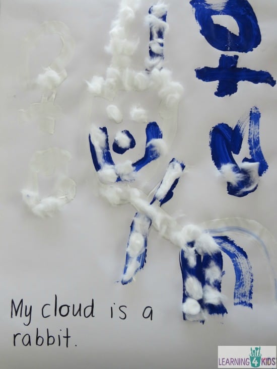 Painting cloud shapes, easel art activity inspired Little cloud by Eric Carle
