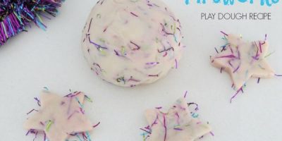 Celebration Fireworks play dough recipe - adding tinsel to create a fireworks affect as fireworks are