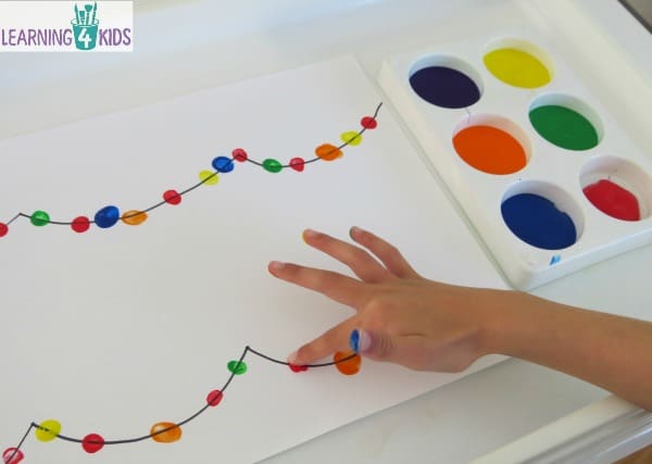 Creating festive or Christmas lights with finger paint.  simple christmas painting activity.