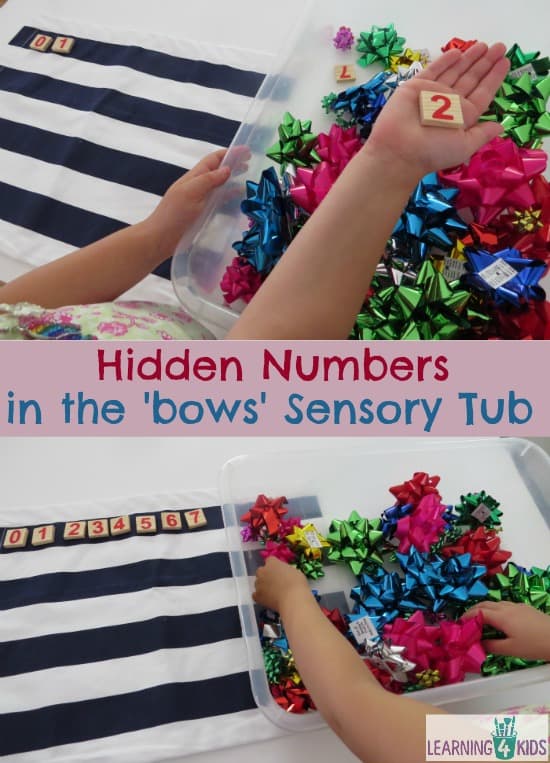 Fireworks (bows) maths theme activity - hidden numbers in a fireworks sensory tub.