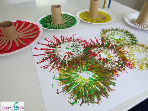 Fireworks celebration activity - painting fireworks with paint and cardboard rolls.