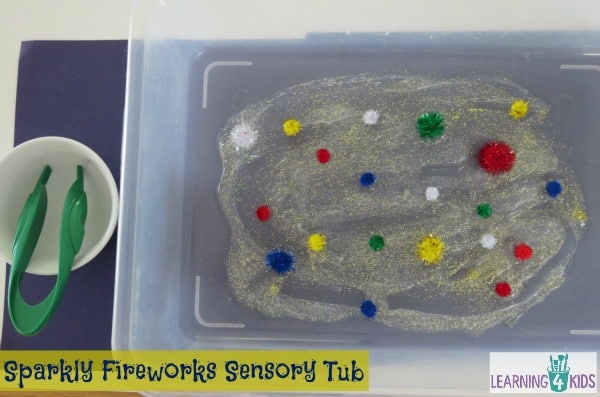 Invitation to play with sparkly firework sensory tub
