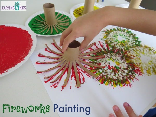 Making fireworks with paint and cardboard rolls.  Great new year's celebration activity