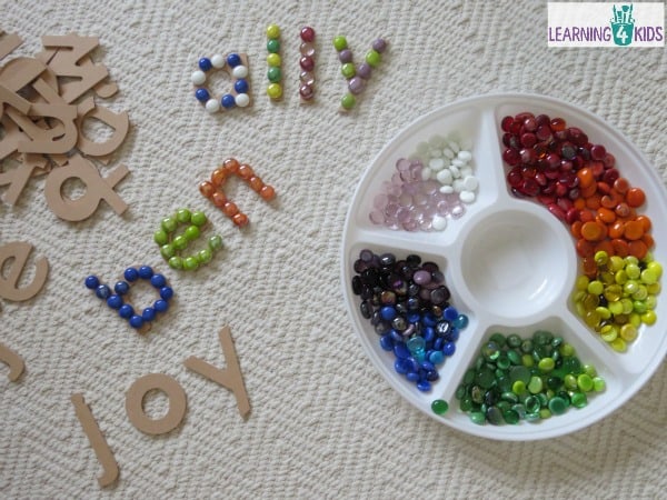 Name activities - making names using large wooden letters and glass gems. super fun.