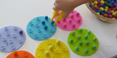 Balancing Felt Balls Challenge for fine motor fun and coordination.