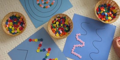 Super simple fine motor activity using buttons (or pebbles) on pattern lines