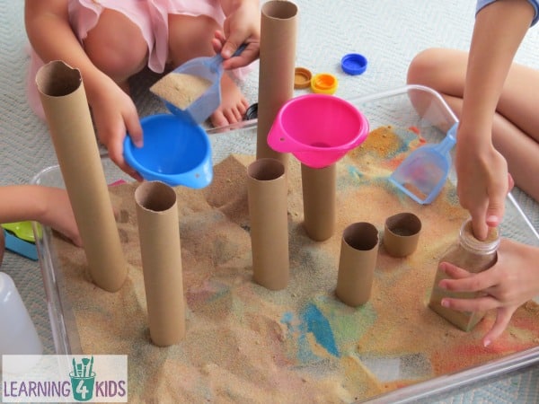 Sensory play with sand and cardboard tubes